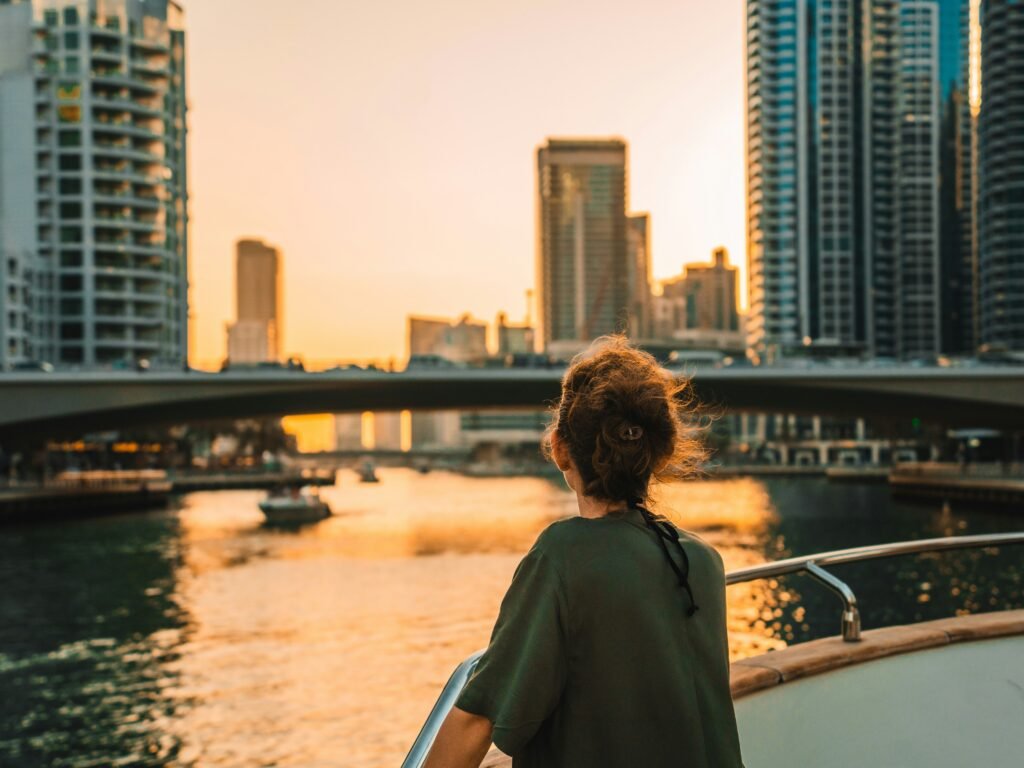 Woman looking out over Dubai Marina at sunset — expat therapy for the Gulf and Middle East