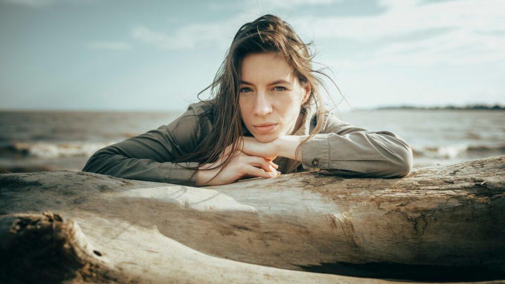 Woman on beach in thought