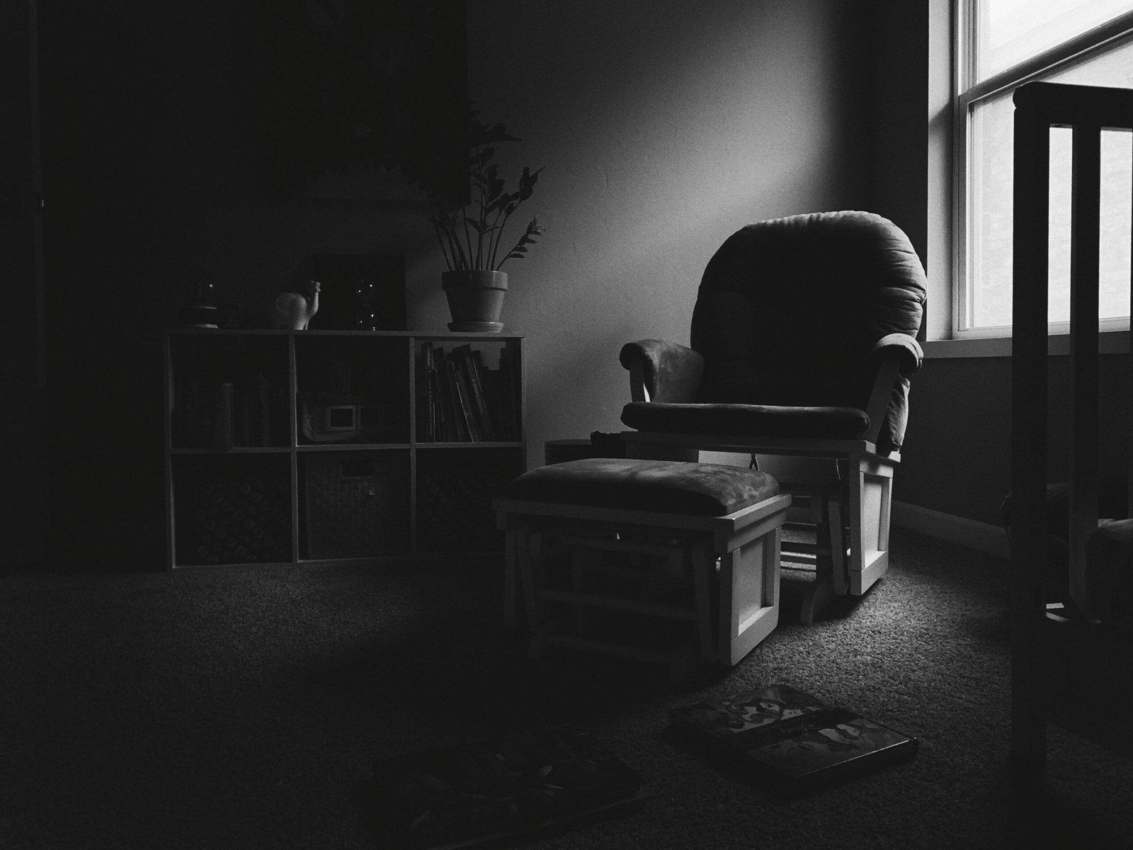 Empty therapy chair in a dark room with window light — when therapy does harm